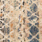 Close-up of blue, beige, and cream abstract rug texture with speckled motifs