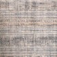 Ivory and beige area rug close-up with dense multicolor speckled grid pattern