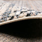 Multicolor speckled area rug with stitched beige border and low-profile edge