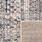 Area rug folded edge showing speckled ivory top and woven beige backing detail