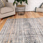 Ivory dark beige area rug with woven geometric grid and scattered multicolor speckles