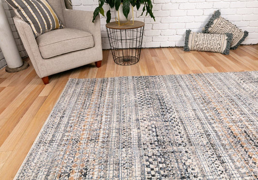 Ivory dark beige area rug with woven geometric grid and scattered multicolor speckles