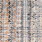 Ivory dark beige area rug close-up with mottled multicolor speckles and grid lines