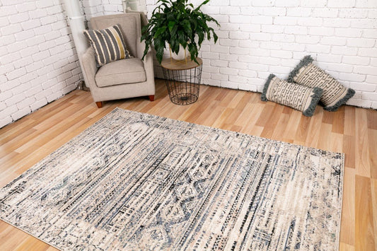Contemporary area rug with ivory, beige, and blue abstract pattern