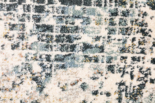 Close-up modern rug with abstract distressed blocks in sky grey and cream