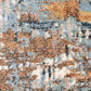 Textured abstract rug surface with speckled blue, orange, and cream tones