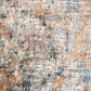 Close-up abstract rug with distressed texture in blue, beige, and warm tan