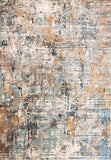 Close-up abstract rug with distressed texture in blue, beige, and warm tan