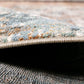 Rug edge detail showing low pile and woven border in blue-gray