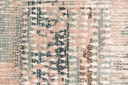 Modern area rug with textured abstract motif in cream, pale blue, and blush pink accents
