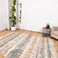 Beige area rug with blue and tan abstract pattern, polypropylene flatweave