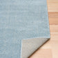 Blue speckled area rug showing folded corner and underside backing. | Eclipse Katana Modern Abstract Polypropylene Area Rug - Rugs Point Australia