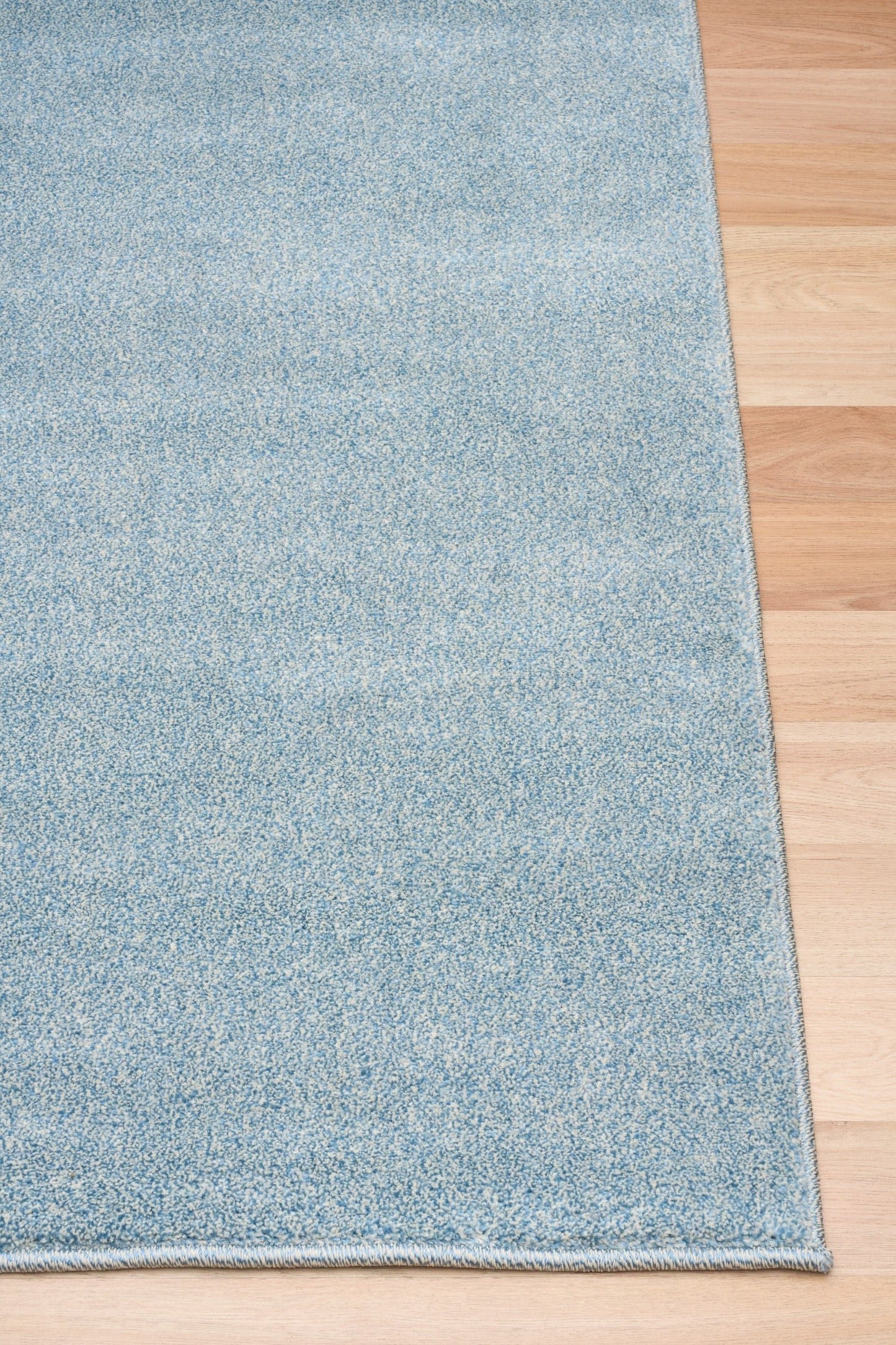 Blue speckled area rug with textured border detail on the edge. | Eclipse Katana Modern Abstract Polypropylene Area Rug - Rugs Point Australia