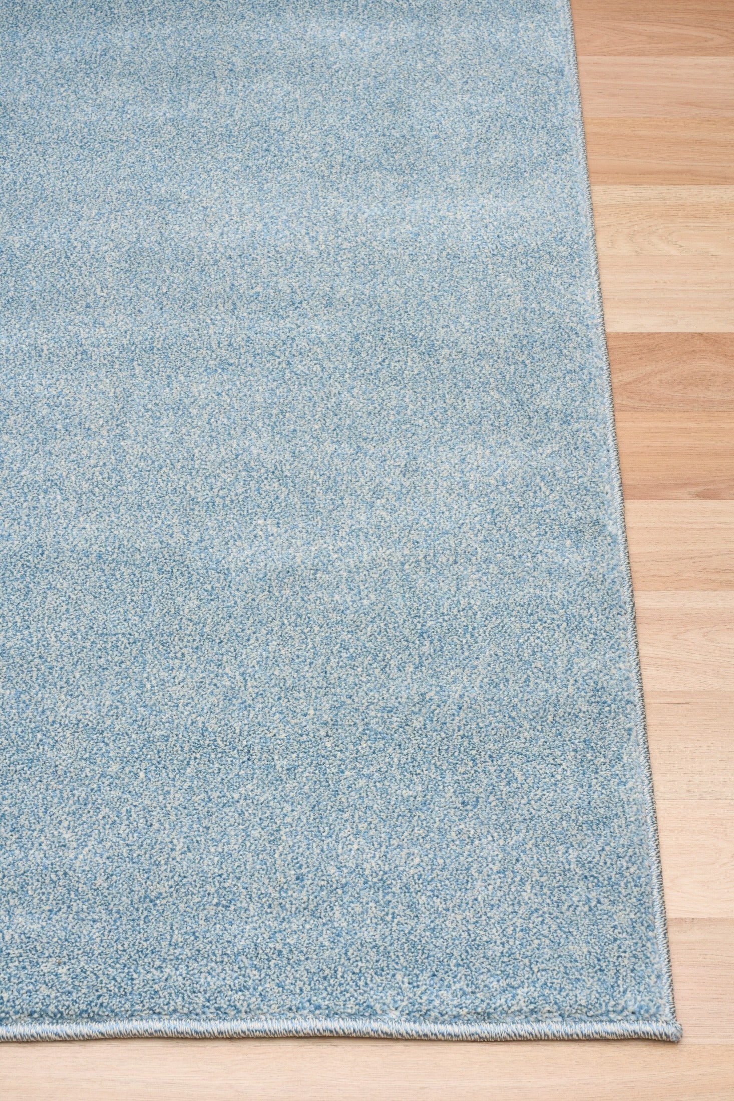 Blue speckled area rug with textured border detail on the edge. | Eclipse Katana Modern Abstract Polypropylene Area Rug - Rugs Point Australia