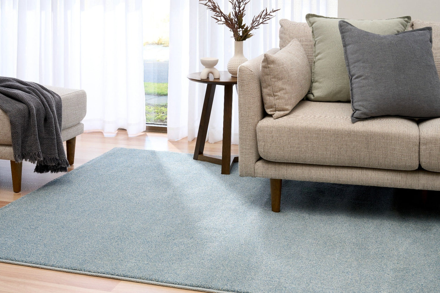 Blue speckled area rug laid on hardwood floor in a living room setting. | Eclipse Katana Modern Abstract Polypropylene Area Rug - Rugs Point Australia
