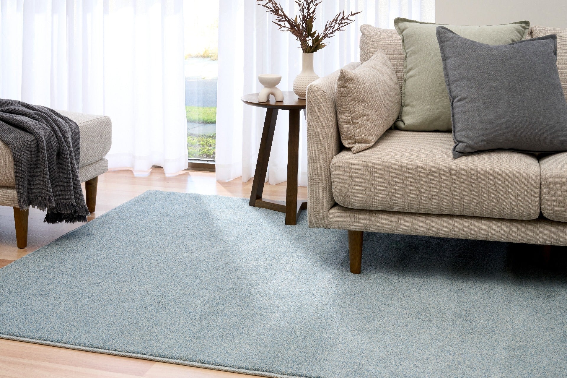 Blue speckled area rug laid on hardwood floor in a living room setting. | Eclipse Katana Modern Abstract Polypropylene Area Rug - Rugs Point Australia