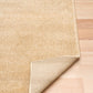 Beige area rug corner showing folded backing on light wood floor | Eclipse Nimes Modern Abstract Living Room Rug - Rugs Point Australia