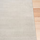 Light gray rectangular area rug with thin border and visible edge seam. | Eclipse Presidente Modern Polypropylene Area Rug - Rugs Point Australia
