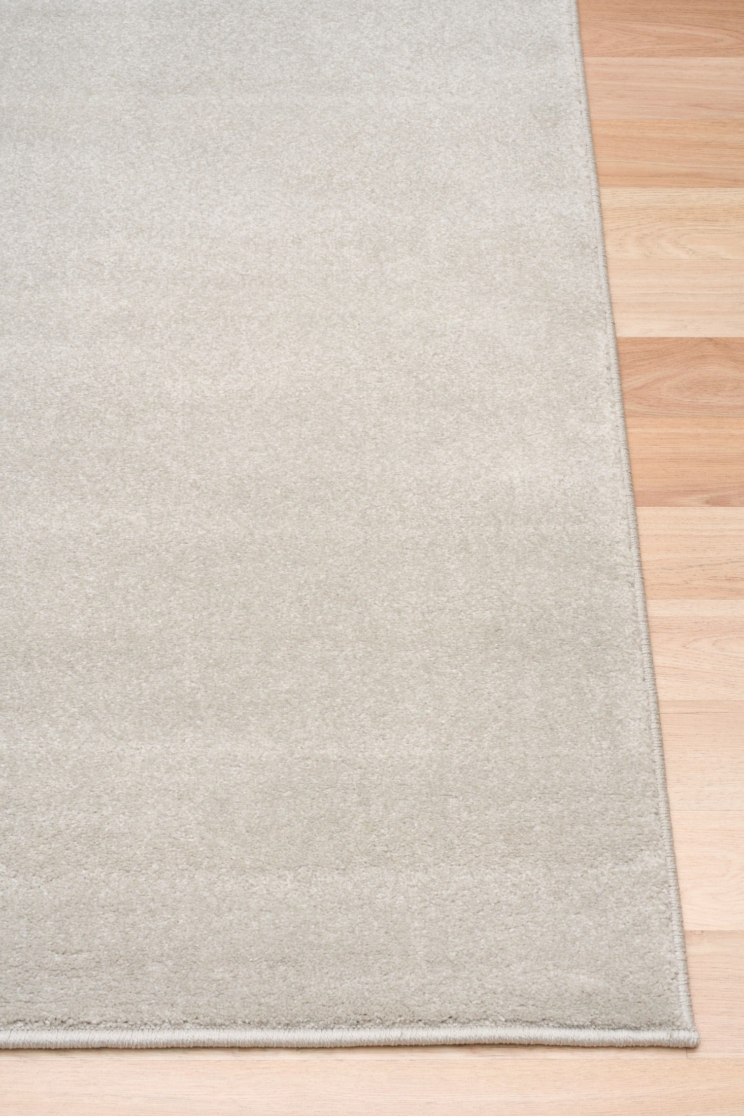 Light gray rectangular area rug with thin border and visible edge seam. | Eclipse Presidente Modern Polypropylene Area Rug - Rugs Point Australia