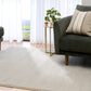 Light gray area rug on the floor in a living room setting. | Eclipse Presidente Modern Polypropylene Area Rug - Rugs Point Australia
