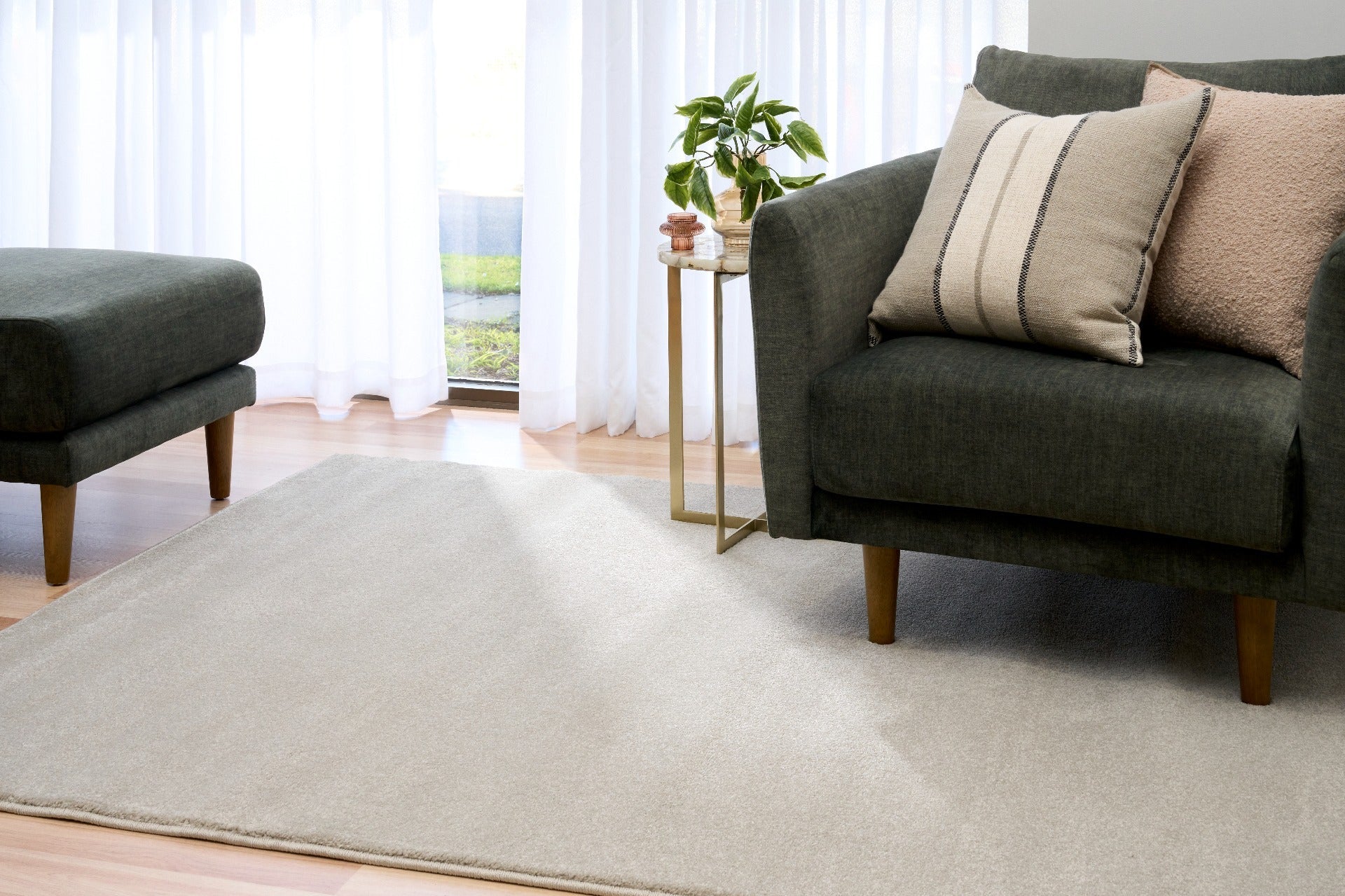 Light gray area rug on the floor in a living room setting. | Eclipse Presidente Modern Polypropylene Area Rug - Rugs Point Australia