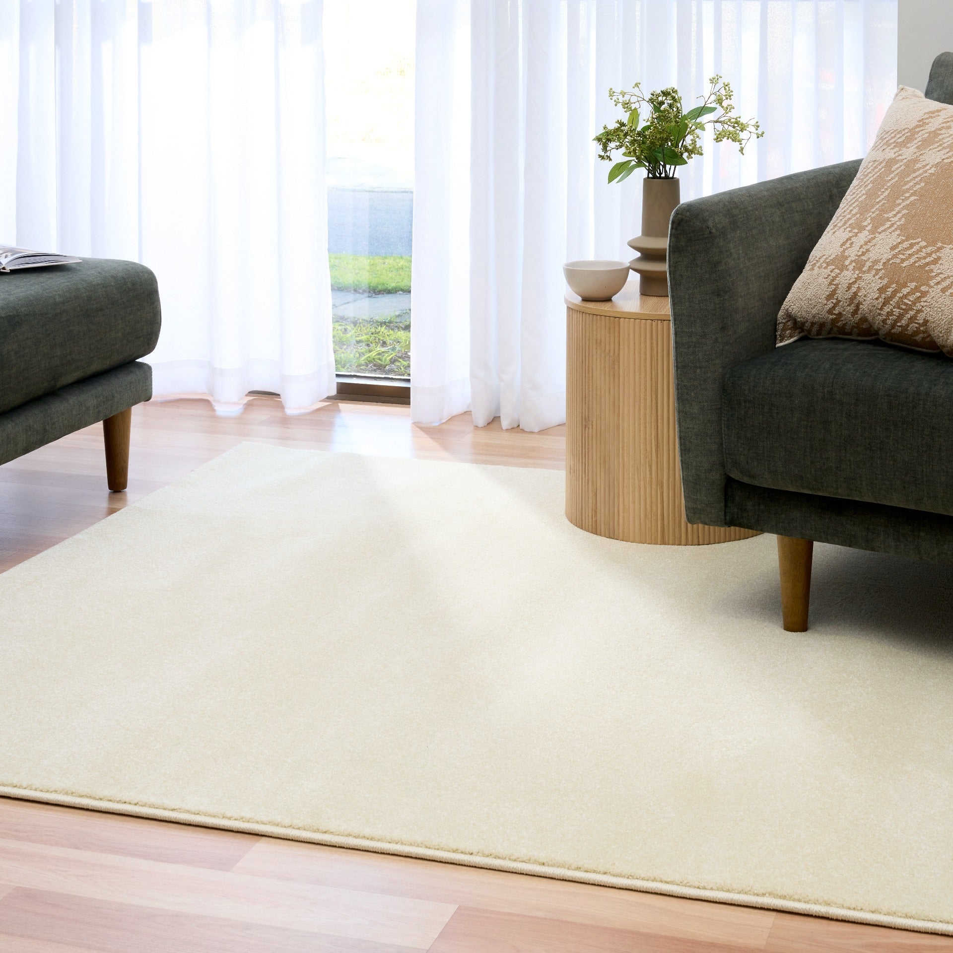 Cream area rug with thin border, full view with furniture nearby | Eclipse Shanghai White Modern Abstract Floor Rug - Rugs Point Australia