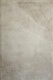 Silver shag rug showing diamond lattice weave and even short shag pile