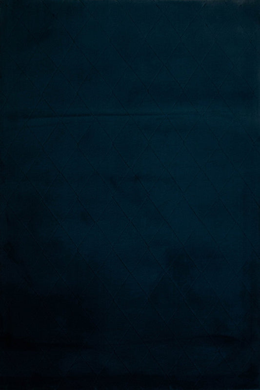 Dark blue shag rug surface with subtle diamond-like pile pattern