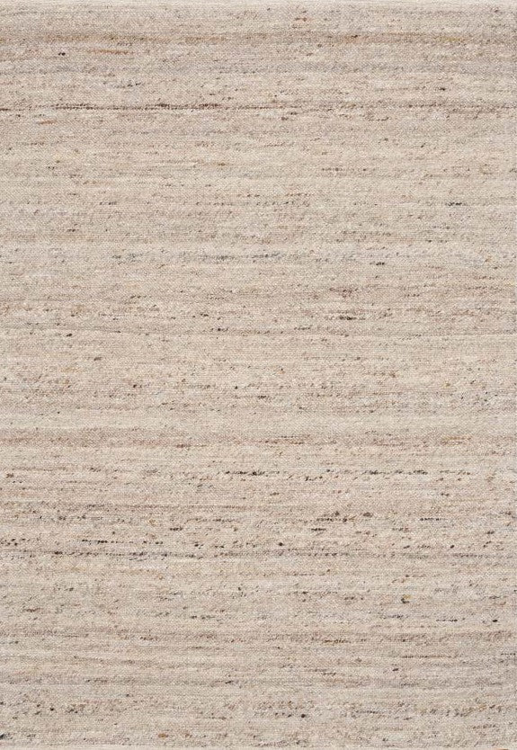 Beige wool rug with subtle speckled texture, close-up of woven fibers