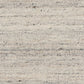 Smoke grey wool rug close-up of speckled woven fibers and horizontal lines