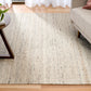 Smoke grey wool rug with speckled low-pile woven texture, rectangular