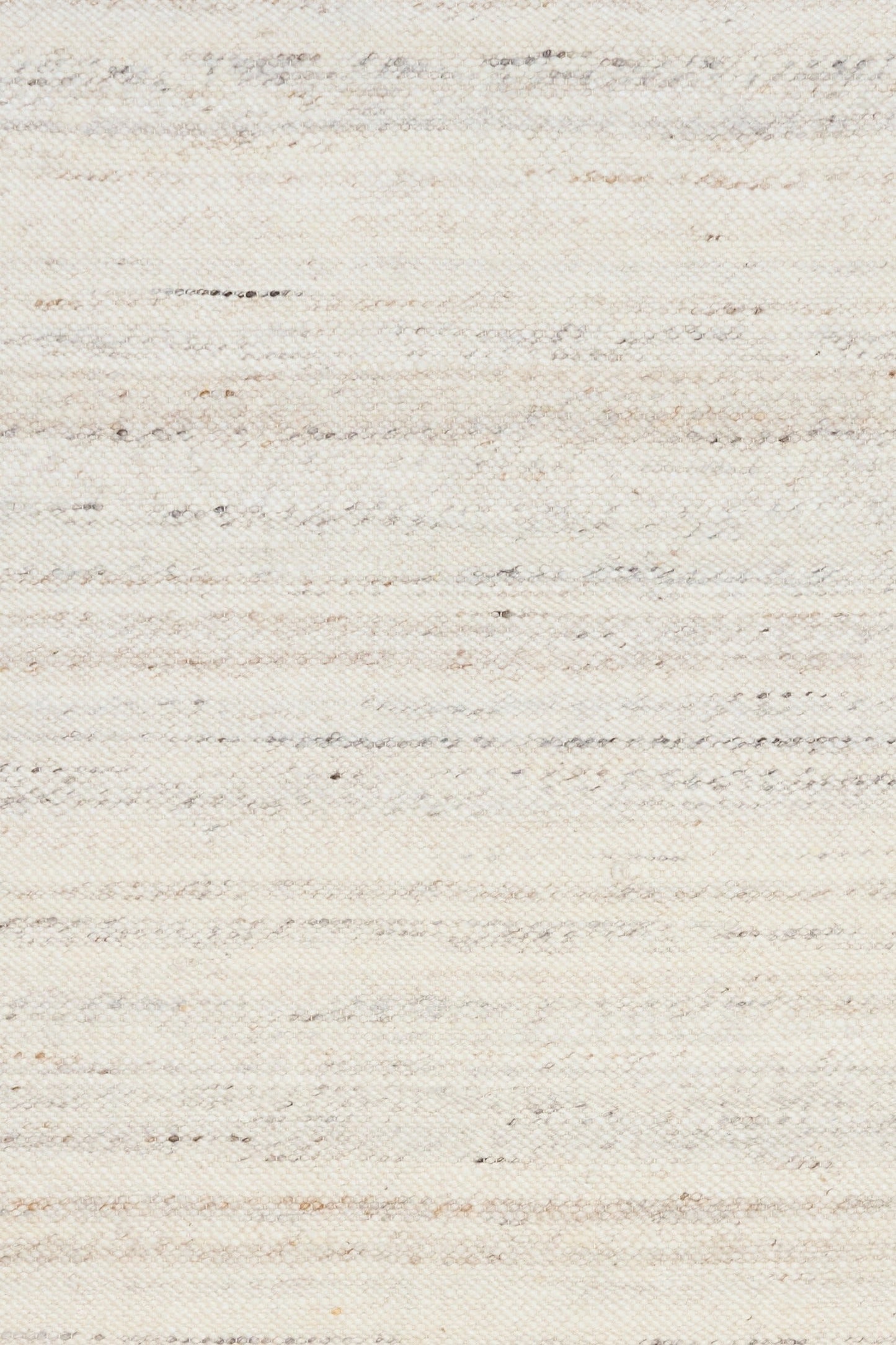 Close-up of white wool rug surface with speckled, woven horizontal pattern