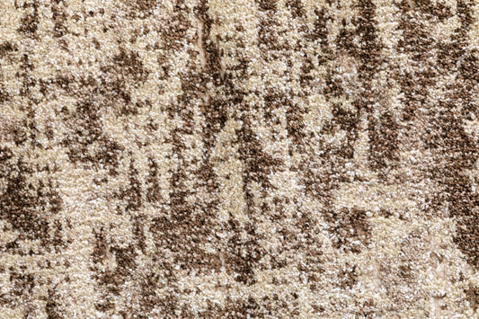 Close-up of cream and dark-brown speckled rug pile texture