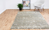 Beige multipurpose rug with distressed speckled pattern and rectangular edges