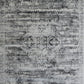 Grey modern area rug with distressed geometric medallion pattern