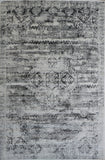 Grey modern area rug with distressed geometric medallion pattern