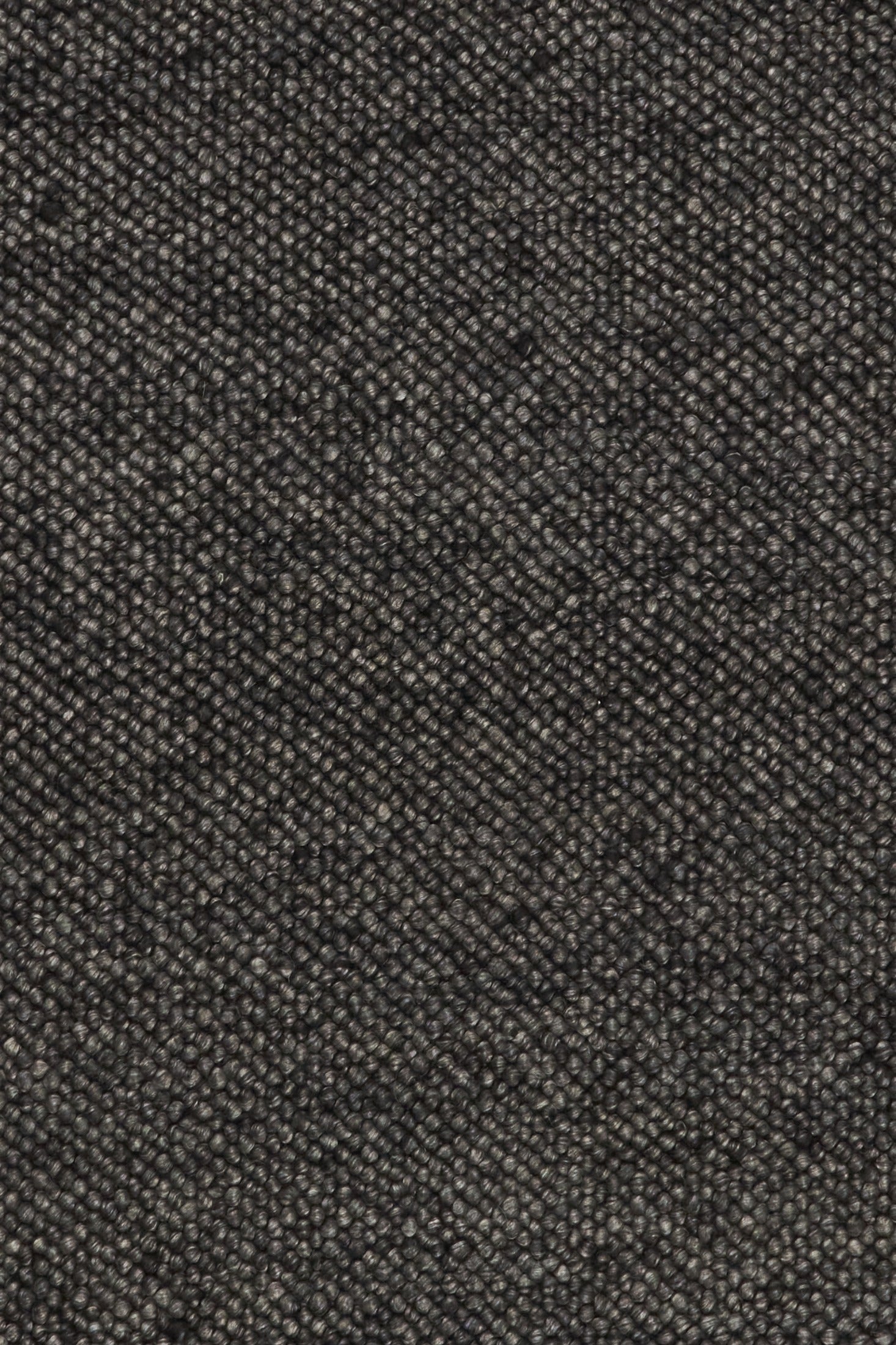Charcoal textured woven rug surface detail