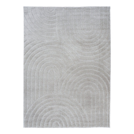 Light grey shag rug with raised circular and wave pattern, close-up