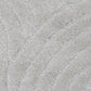 Light grey shag rug with stitched wave pattern and textured pile