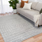 Light grey shag rug with wave and circular stitched design, visible corner