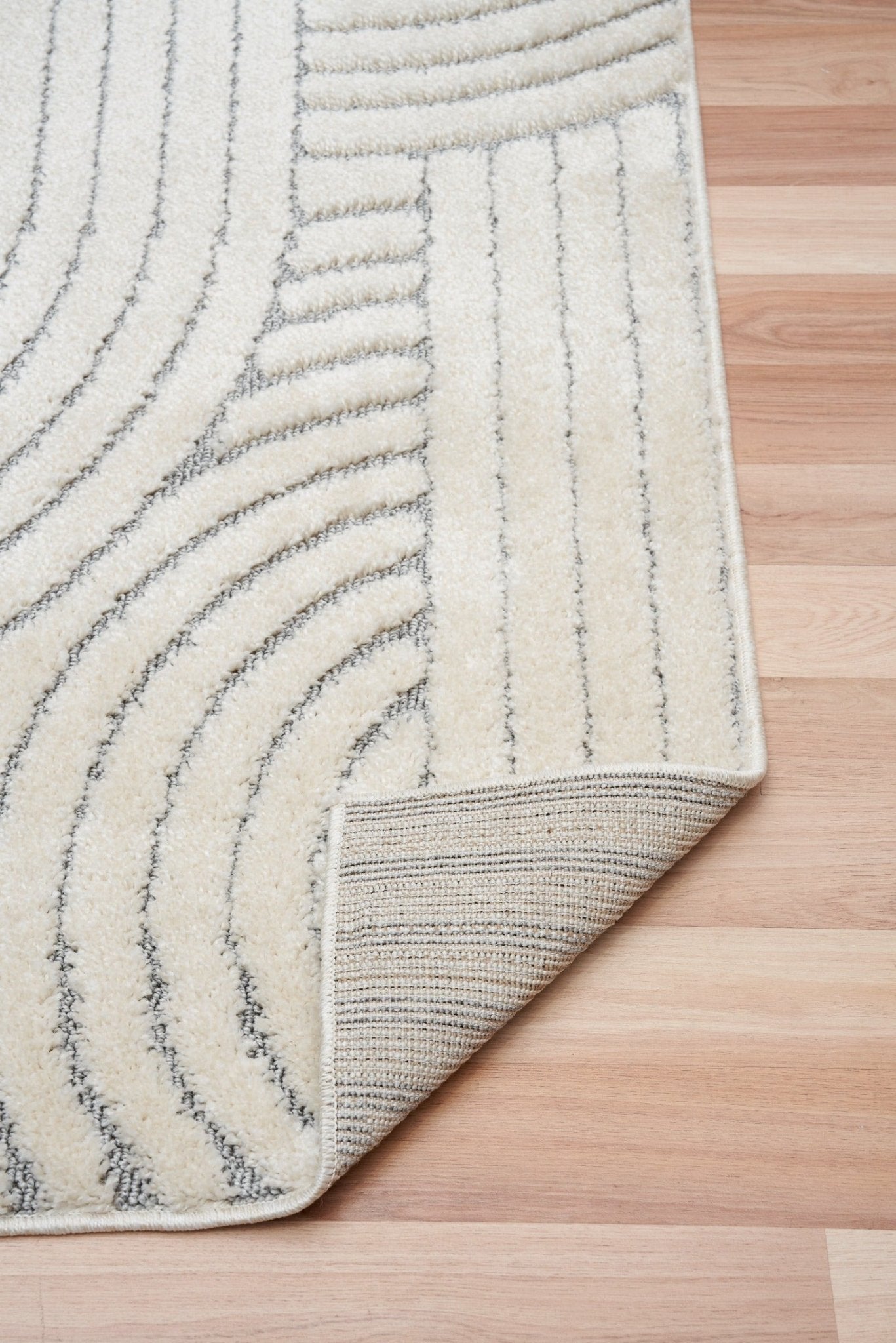 Marli Soft living room rug corner edge with ivory backing and light grey curved lines | Marli Soft Living room rug 12417 Ivory Light Grey Modern Abstract Living Room Rug - Rugs Point Australia