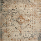 Oversized rectangular area rug with pale ivory field, intricate blue and rust motifs