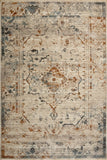 Oversized rectangular area rug with pale ivory field, intricate blue and rust motifs