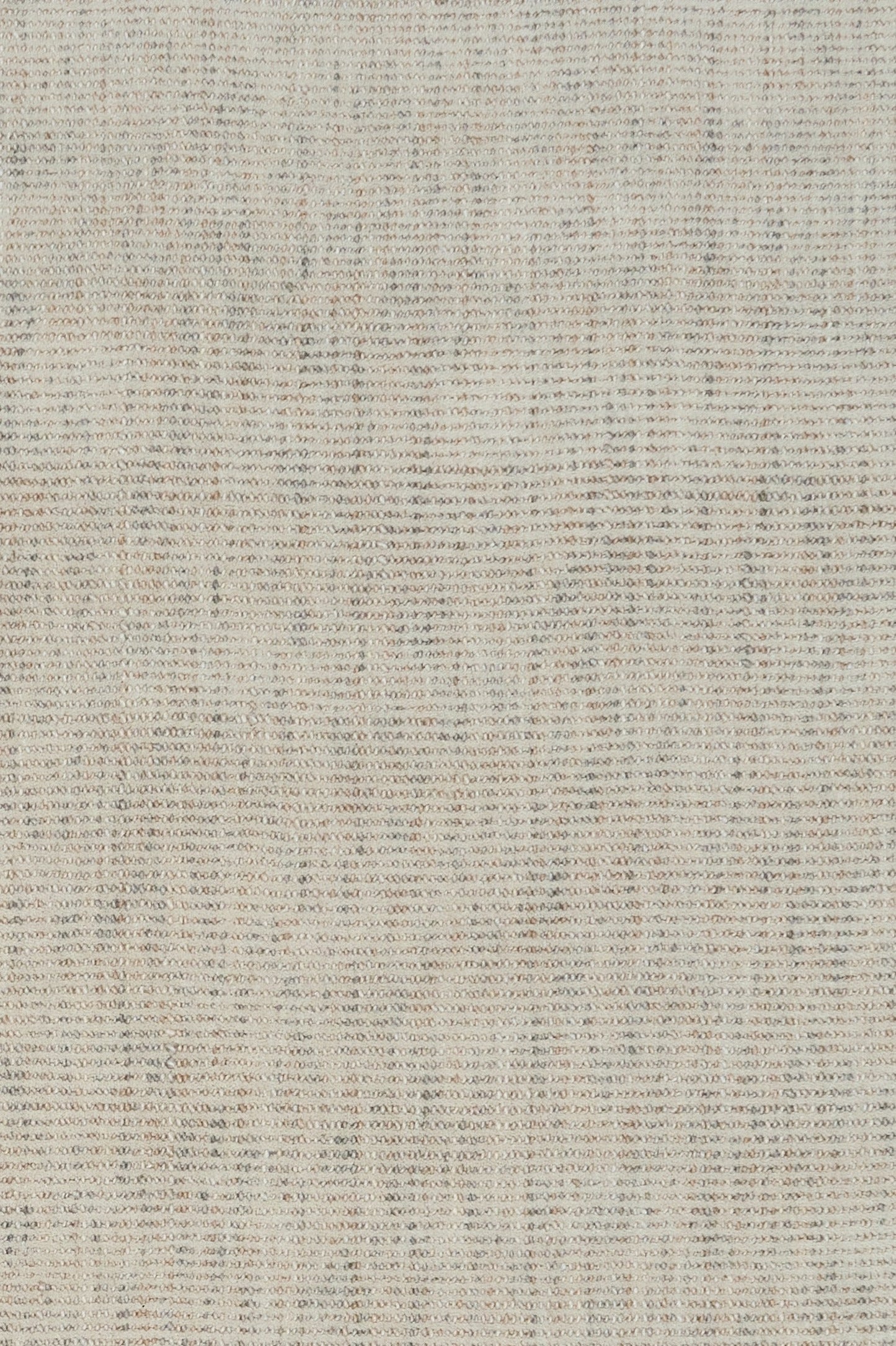 Light gray woven rug surface with tight, speckled textured weave
