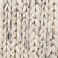 Ivory chunky wool knit rug surface with raised looped ridges
