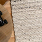 Ivory chunky knit wool floor rug with ribbed texture and thick pile