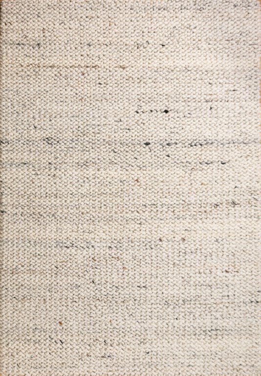 Light neutral wool rug with tight woven texture and subtle speckled flecks