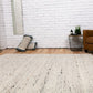 Luxury wool rug in light neutral, chunky loop-knit texture with dense pile
