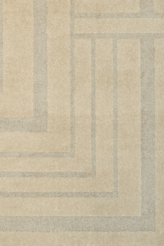 Beige geometric area rug close-up of layered square motif
