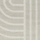 Light gray area rug with abstract arch and bar stripe pattern, close-up